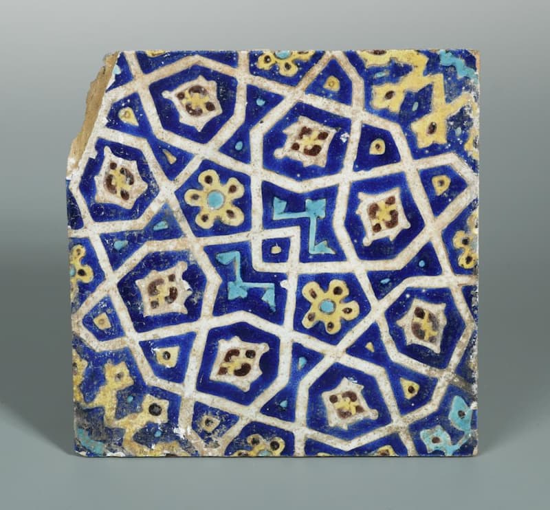 Islamic Persian Timurid tile, decorated with stylised flower heads and motifs